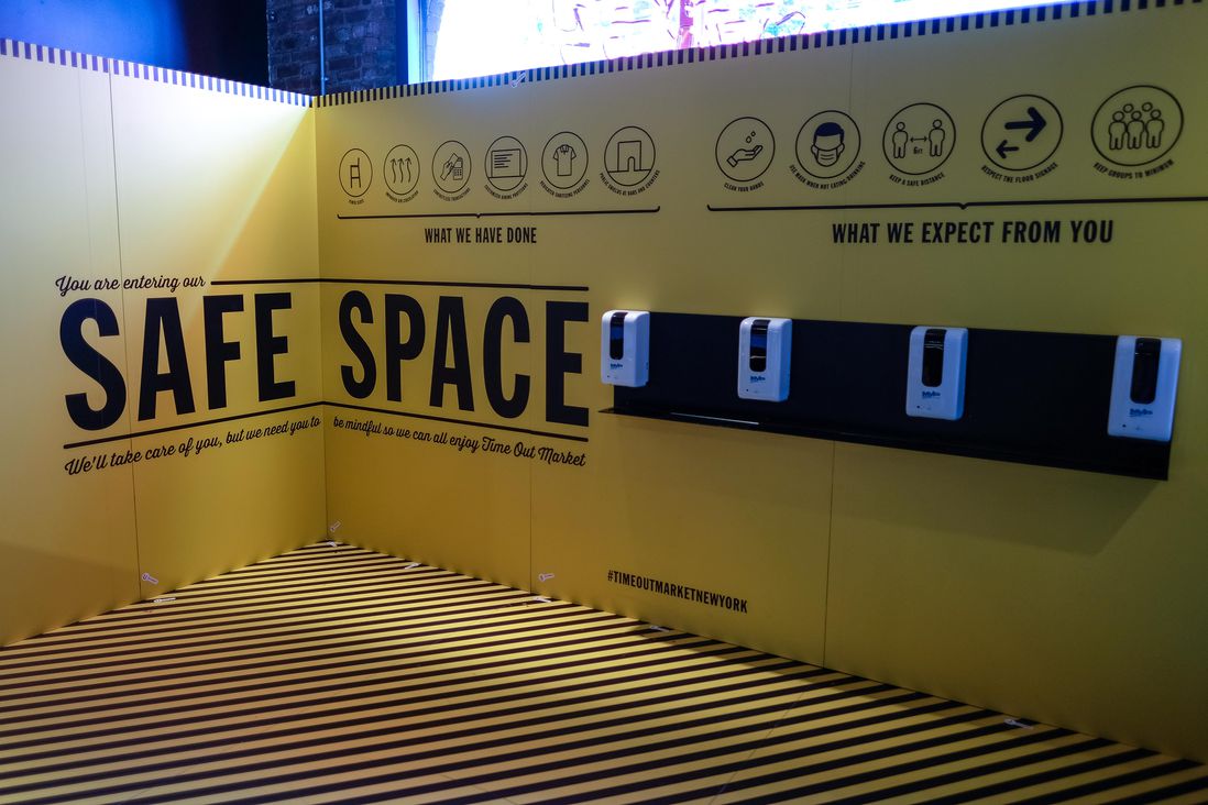 sanitation station with "safe space" sign